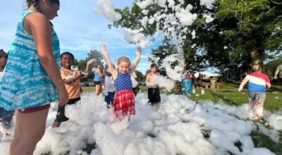 Children enjoyed playing in the foam prior to the fireworks show.