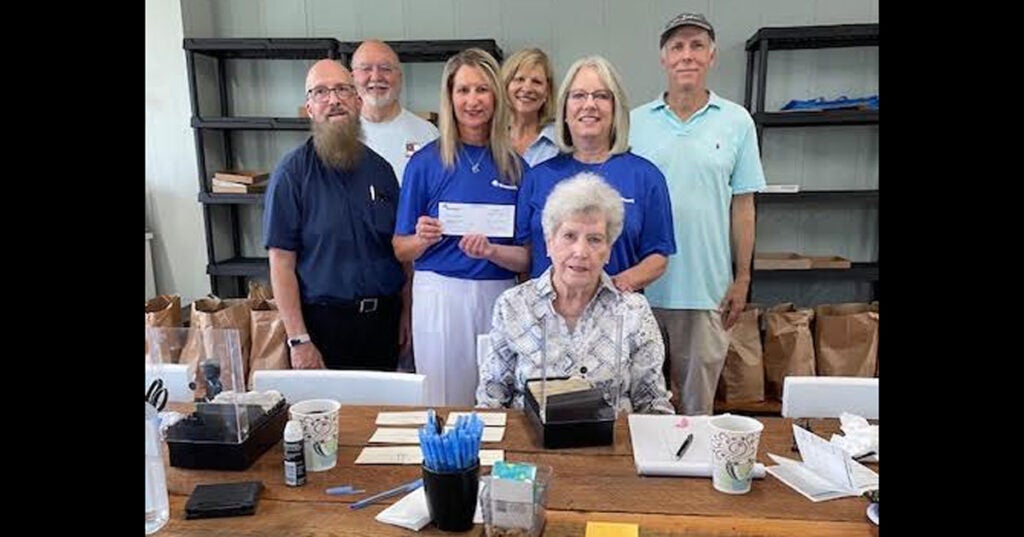 Monica Cox and Lydia Buroker from Demopolis Trustmark presented a donation to the Demopolis Food Pantry volunteers: Rebecca Culpepper, Rector Evan Thayer, Bill Arrington, Kaye Evans, and Steven Richardson